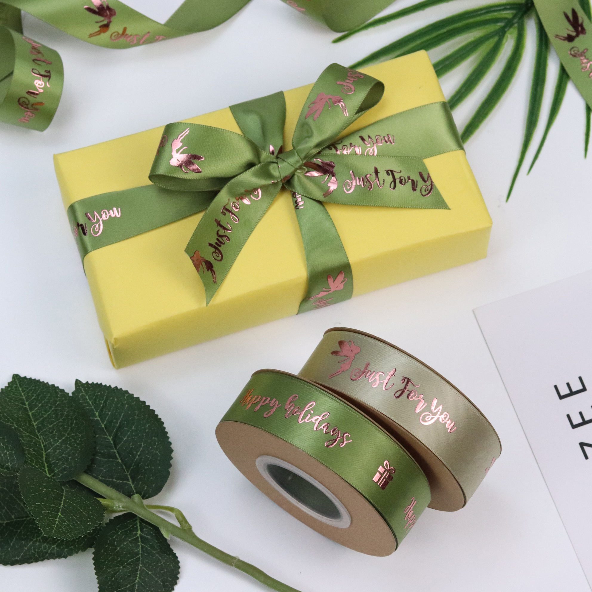 Custom satin ribbon bow on wrapped gift personalized ribbon for brand packaging