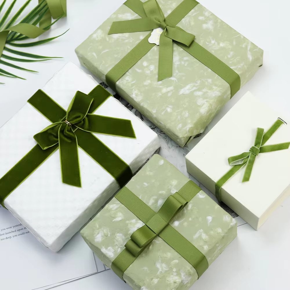 Ribbon bows on gift boxes for seasonal packaging programs